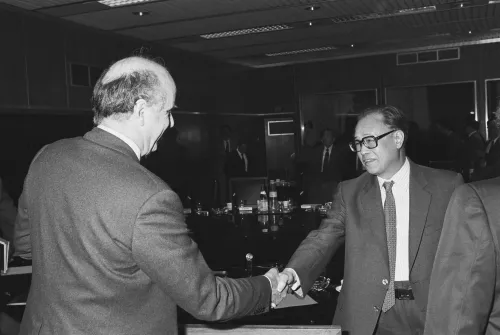 Handshake between Zhao Ziyang, on the right, and Etienne Davignon